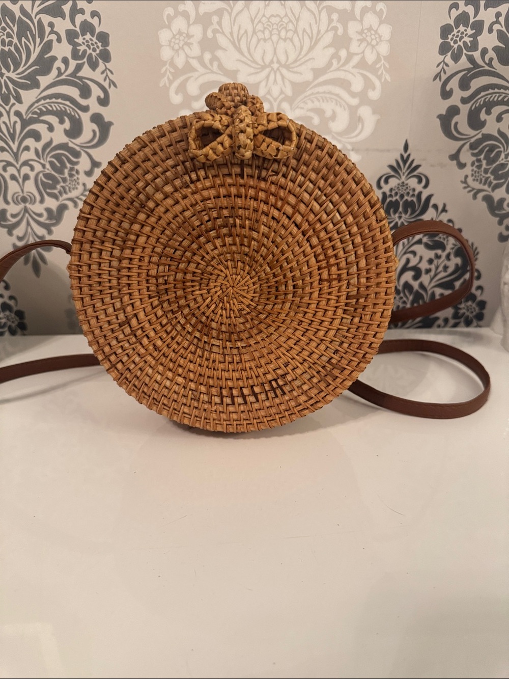 Boho woven round basket shoulder/purse, lined inside, with a faux leather strap.